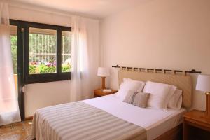 Posteľ alebo postele v izbe v ubytovaní Casa adosada en Pals Playa by Apartaments Golf