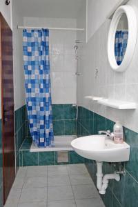 a bathroom with a sink and a shower at Apartments by the sea Privlaka, Zadar - 5813 in Privlaka