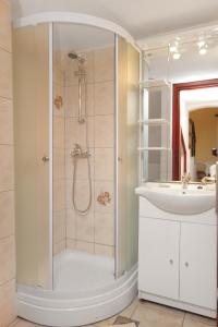 a bathroom with a shower and a sink at Apartments by the sea Postira, Brac - 5672 in Postira