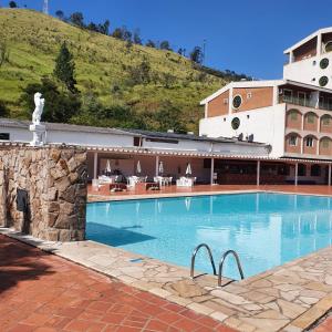Poolen vid eller i närheten av Flat 206 Hotel Cavalinho Branco (3 piscinas, elevador, sauna)