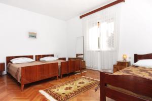Posteľ alebo postele v izbe v ubytovaní Apartments with a parking space Biograd na Moru, Biograd - 5899