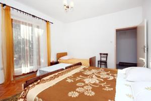 Posteľ alebo postele v izbe v ubytovaní Apartments with a parking space Biograd na Moru, Biograd - 5899