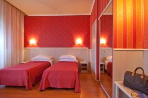 Postel nebo postele na pokoji v ubytování Hotel Garda