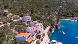 an aerial view of a house on a beach with a boat at Apartments by the sea Cove Pokrivenik, Hvar - 4604 in Gdinj