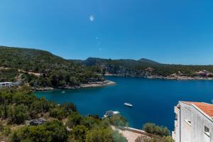 a view of a lake with a boat in it at Apartments by the sea Cove Pokrivenik, Hvar - 4604 in Gdinj