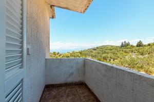 a balcony with a view of the ocean at Apartments by the sea Cove Pokrivenik, Hvar - 4604 in Gdinj