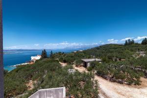 a view of the ocean from a hill at Apartments by the sea Cove Pokrivenik, Hvar - 4604 in Gdinj