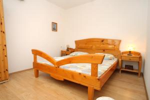 A bed or beds in a room at Apartments by the sea Lumbarda, Korcula - 4376