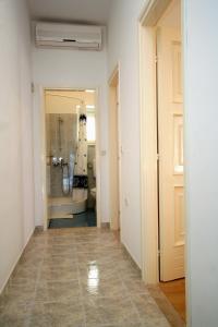 a hallway with a room with a sink and a mirror at Apartments by the sea Lumbarda, Korcula - 4358 in Lumbarda