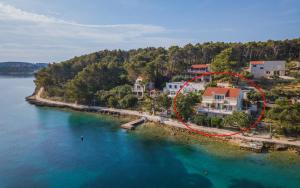 an aerial view of a house in the water at Apartment Lumbarda 4446b in Lumbarda