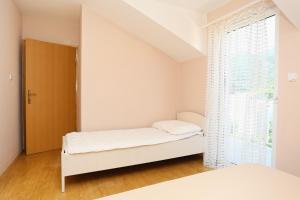 Postel nebo postele na pokoji v ubytování Apartment Zuljana 4576a