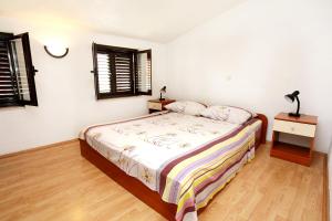 Posteľ alebo postele v izbe v ubytovaní Apartments by the sea Trstenik, Peljesac - 4567
