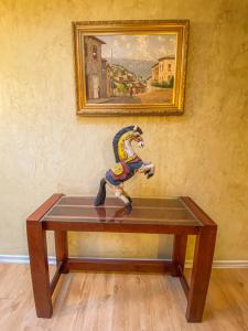 a figurine of a horse on top of a table at Hotel Londres La Serena in La Serena