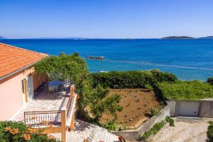 an aerial view of a house and the ocean at Family friendly seaside apartments Orebic, Peljesac - 4537 in Orebić