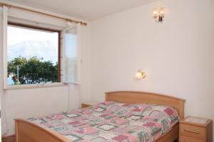 Postel nebo postele na pokoji v ubytování Apartments by the sea Zrnovska Banja, Korcula - 4363