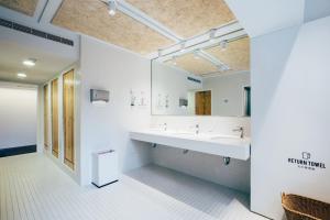 a bathroom with a sink and a mirror at Star Hostel Taipei East in Taipei