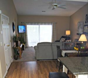 a living room with a couch and a table at Branson Krehbiel Condo 2Bd 2Bath in Branson