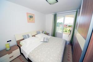 Posteľ alebo postele v izbe v ubytovaní Apartments with parking spaces Orebic, Peljesac - 4536