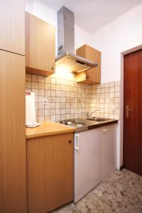 a kitchen with a sink and a counter top at Studio Orebic 4496d in Orebić