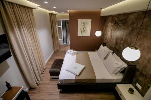 Postel nebo postele na pokoji v ubytování Vecchia Boutique Hotel