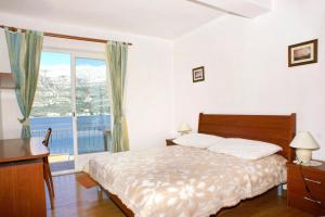 Posteľ alebo postele v izbe v ubytovaní Apartments by the sea Korcula - 4367