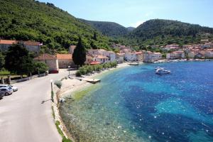 a town on the shore of a body of water at Double Room Racisce 4341a in Račišće