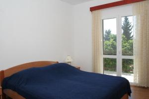 Posteľ alebo postele v izbe v ubytovaní Apartments with parking spaces Orebic, Peljesac - 4494