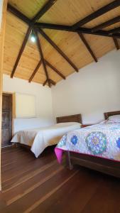 A bed or beds in a room at Balcones de El Carrizal