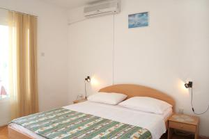 Postel nebo postele na pokoji v ubytování Apartments and rooms by the sea Orebic, Peljesac - 4553