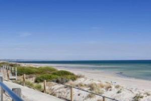 a view of a beach with the ocean at Beach Retreat in Henley Beach South