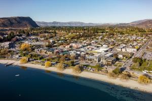 an aerial view of a town next to a body of water at Aspiring Lodge Motel in Wanaka