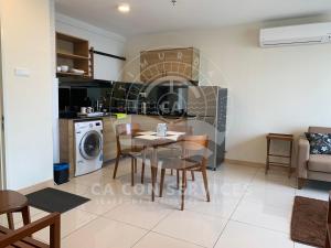 a kitchen and living room with a table and chairs at TimurBay Stunning By CA CON in Kuantan +46 photos