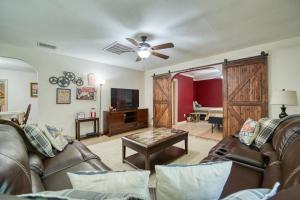 a living room with two leather couches and a table at Large Tampa Home*Sleeps 16*Near Busch Gardens &USF in Tampa