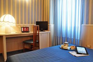 Postel nebo postele na pokoji v ubytování Hotel Garda