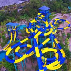 een luchtzicht op een waterpark met een waterglijbaan bij Forest Paradise Inn Teluk Bahang PRIVATE MALAY TRADITIONAL HOUSE CONCEPT HOTEL in Teluk Bahang