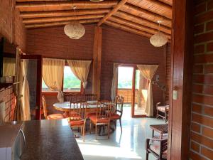a dining room with a table and chairs at Marybutch in Manglaralto