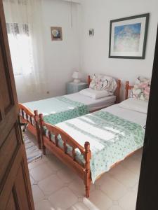 Postel nebo postele na pokoji v ubytování Beach apartment, Paralia Dionysiou, Chalkidiki