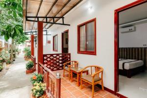 Postel nebo postele na pokoji v ubytování Ngoc Qui Bungalow