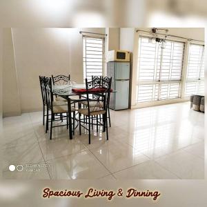 a kitchen and dining room with a table and chairs at DAC Peaceful AC King Bed WIFI & 24hr Security in Dhaka