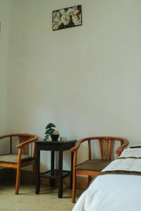 Postel nebo postele na pokoji v ubytování Ngoc Qui Bungalow