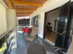 TV a/nebo společenská místnost v ubytování Residence4a-Appartamento Rosso