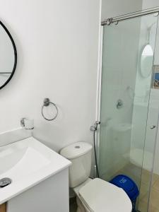 a bathroom with a toilet and a glass shower at Le MARIE B&B in Cartagena de Indias