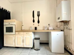 Kuchyňa alebo kuchynka v ubytovaní Appartement au coeur de Dunkerque
