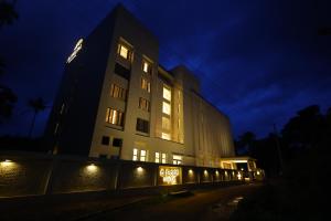 a building at night with lights on at The Aurum Subrahmanya in Subrahmanya