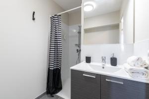 a bathroom with a sink and a shower at Student Factory Montpellier Sud in Montpellier