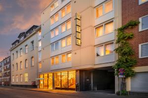 a rendering of the front of a building at Novum Hotel Leonet Köln Altstadt in Cologne