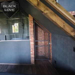 a room with a brick wall and a window at Love Apartmanok Eger in Eger +41 photos