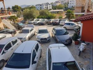 a bunch of cars parked in a parking lot at Hotel Lula Ksamil in Ksamil