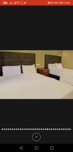 Ein Bett oder Betten in einem Zimmer der Unterkunft Tai Hoe Hotel Pengerang