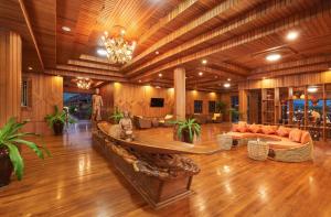 a large living room with a couch and a table at KMA Inle Hotel in Nyaungshwe Township